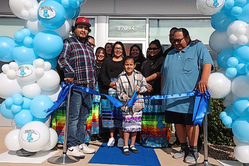 04102024
Birdtail Sioux First Nation Chief Lindsay Bunn Jr., Dakota Urban Case Manager for Canupawakpa and former Sioux Valley Dakota Nation Chief Jennifer Bone and Canupawakpa Dakota Nation Chief Raymond Brown surround seven-year-old Fawn Kasto of Birdtail Sioux First Nation, and living in Brandon, along with other dignitaries as she cuts the ribbon during the grand opening of the Dakota Urban Jordan&#x2019;s Principal office on Richmond Avenue in Brandon on Friday. 
(Tim Smith/The Brandon Sun)