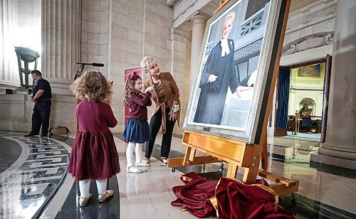 Ruth Bonneville / Free Press

LOCAL STDUP - speaker portrait

Myrna Driedger, 30th speaker of the Manitoba Legislative Assembly unveils her portrait with the help of her two granddaughters, Addison (almost 6yrs, red bow) and her sister Briar (3yrs, blue bow), at a special ceremony in the Rotunda at the Legislative Building Friday. 

Topic: Unveiling ceremony for the official portrait ofMyrna Driedger, the 30th speaker of theManitoba Legislative Assembly

Who: Tom Lindsey, 31st speaker of the ManitobaLegislative Assembly helped with the unveiling.  


Oct 4th , 2023
