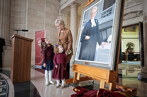 Ruth Bonneville / Free Press

LOCAL STDUP - speaker portrait

Myrna Driedger, 30th speaker of the Manitoba Legislative Assembly unveils her portrait with the help of her two granddaughters, Addison (almost 6yrs, red bow) and her sister Briar (3yrs, blue bow), at a special ceremony in the Rotunda at the Legislative Building Friday. 

Topic: Unveiling ceremony for the official portrait ofMyrna Driedger, the 30th speaker of theManitoba Legislative Assembly

Who: Tom Lindsey, 31st speaker of the ManitobaLegislative Assembly helped with the unveiling.  


Oct 4th , 2023
