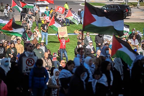 Mike Sudoma/Free Press
Pro Palestinian protesters hold signs and fly Palestinian flags during a rally at the Manitoba Legislative Grounds Saturday afternoon 
October 5, 2024
