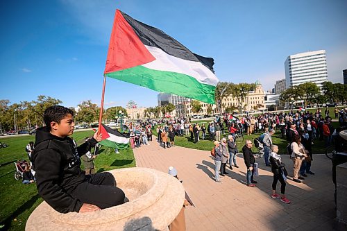 Mike Sudoma/Free Press
Young supporter Najmeddin Elbakri flies a Palestinian flag during a pro Palestinian rally at the Manitoba Legislative Grounds Saturday afternoon 
October 5, 2024
