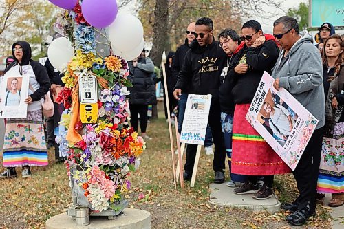 Nicole Sutherland is comforted at the memorial McDowell/Brandon Sun)