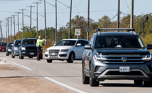 JOHN WOODS / FREE PRESS
A police officer directs traffic on Wilkes at Elmhurst Sunday, October 6, 2024. The Oasis Church on Elmhurst requires two city cops to direct traffic before and after their services.

Reporter: