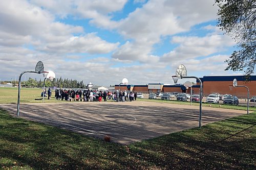 The memorial walk for Antoine Sutherland meets at the basketball courts of Vincent Massey High School. A memorial bench is being planned to be installed there to honour the late 15-year-old Antoine Sutherland, a student who was killed on his way home from basketball last year. (Connor McDowell Brandon Sun)