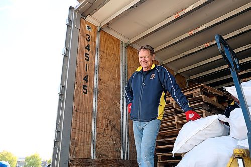 Club volunteer Brian Deutscher stands over the last handful of potato bags to be sold on Saturday. (Connor McDowell/Brandon Sun)