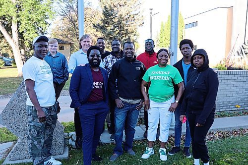 Brandon Mayor Jeff Fawcett and some members of the city's Nigerian community stand for a picture after the flag-raising event at city hall on Monday morning. (Abiola Odutola/The Brandon Sun)