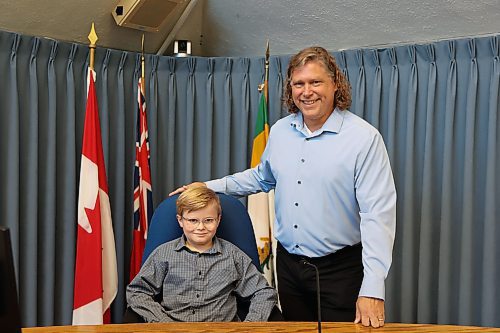 Mayor for a Day Frasier McArthur, 9, poses for a picture with Mayor Jeff Fawcett inside the Council Chamber on Monday. (Abiola Odutola/The Brandon Sun)