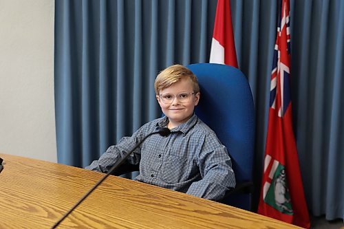 Frasier McArthur sits in the big chair in the Brandon City Council Chamber on Monday. The nine-year-old from École New Era School served as Brandon’s "Mayor for a Day," a position he has been dreaming of for more than a year. “I feel happy and looking forward to sharing my experience with my friends in school tomorrow,” he said. Fawcett praised the boy’s passion and initiative, noting their year-long relationship, which began when Frasier wrote letters to him requesting to be the mayor of the city for one day. (Abiola Odutola/The Brandon Sun)