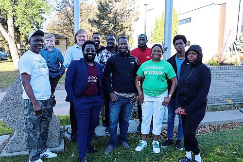 Brandon Mayor Jeff Fawcett and some members of the Nigerian community based in Brandon take a picture after the flag raising event at the City Hall on Monday morning. (Abiola Odutola/The Brandon Sun)