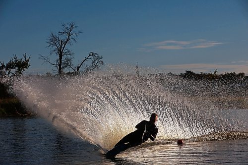 07102024
Daryl Makinson with the Brandon Waterski Club carves up a wave of water while slalom skiing on the Assiniboine River in Brandon on a warm and sunny Monday evening. 
(Tim Smith/The Brandon Sun)