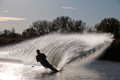 07102024
Daryl Makinson with the Brandon Waterski Club carves up a wave of water while slalom skiing on the Assiniboine River in Brandon on a warm and sunny Monday evening. 
(Tim Smith/The Brandon Sun)