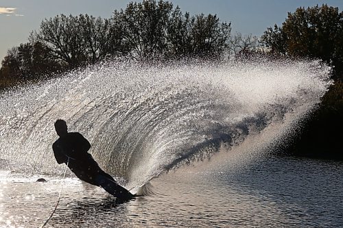 07102024
Daryl Makinson with the Brandon Waterski Club carves up a wave of water while slalom skiing on the Assiniboine River in Brandon on a warm and sunny Monday evening. 
(Tim Smith/The Brandon Sun)