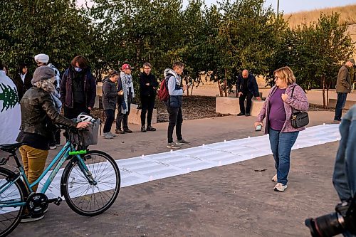 Mike Sudoma/Free Press
Pro Palestinian supporters take a moment to read the long list of names of people under the age of 18 who fell casualty to the Gaza conflict one year ago today 
October 7, 2024
