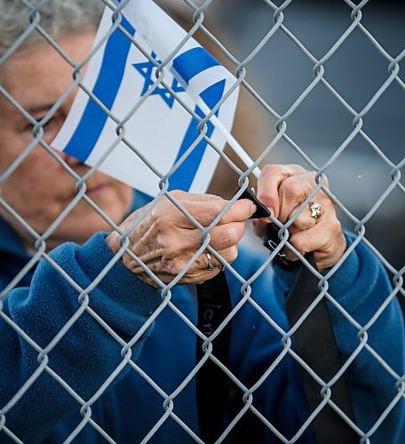 JOHN WOODS / WINNIPEG FREE PRESS
People pin ribbons with victim names, attend a walk and memorial in support of victims of Oct 7  in Winnipeg Monday, October 7, 2024. 

Reporter: ?