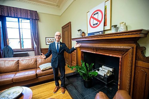 MIKAELA MACKENZIE / FREE PRESS

	
Education minister Nello Altomare shows new school signage (related to the cell phone ban) in his office at the Manitoba Legislative Building on Thursday, Aug. 15, 2024. 

For Carol story.