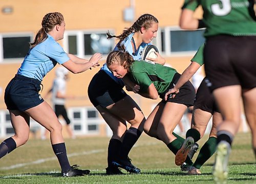 Dauphin Clippers Paityn Bourgouin tackles a Rivers Rams ballcarrier during their Westman High School Rugby sevens game at Vincent Massey on Tuesday. (Thomas Friesen/The Brandon Sun)