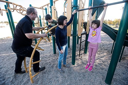 JOHN WOODS / WINNIPEG FREE PRESS
Angela Schellenberg with husband and their children Anna and Henry have fun on the play structure at Donwood School in Winnipeg Tuesday, October 8, 2024. The children are in a german language program.

Reporter: maggie