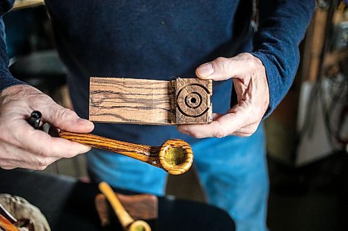 MIKAELA MACKENZIE / WINNIPEG FREE PRESS
	
Jeff Nelson, who makes wooden pipes for pot smokers, shows a finished pipe along with one in progress in his garage workshop on Monday, Sept. 23, 2024. 

For AV story.
Winnipeg Free Press 2024