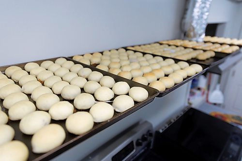 MIKE DEAL / FREE PRESS
Buns cool off before being packaged.
Deb Rogalsky, founder of Deb's Meat Buns, runs her home-based enterprise out of a commercial kitchen attached to her home in Landmark, Manitoba. 
She bakes as many as 300 dozen meat buns a week.
She turns out over a dozen varieties of meat buns, or perishky, including pulled pork, buffalo chicken and taco - as well as one called the Original (ground beef, onions, mashed potatoes) based on a recipe developed by Deb's mom, decades ago. 
Reporter: Dave Sanderson
241009 - Wednesday, October 09, 2024.