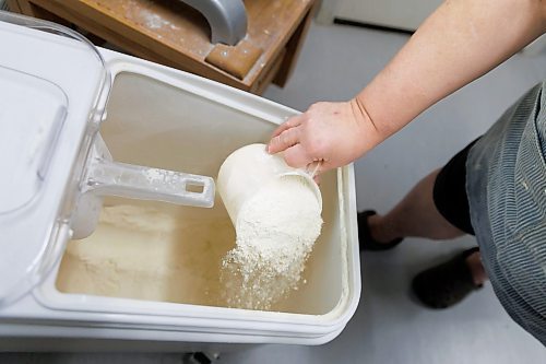 MIKE DEAL / FREE PRESS
Making the dough, Deb adds flour to the mixer.
Deb Rogalsky, founder of Deb's Meat Buns, runs her home-based enterprise out of a commercial kitchen attached to her home in Landmark, Manitoba. 
She bakes as many as 300 dozen meat buns a week.
She turns out over a dozen varieties of meat buns, or perishky, including pulled pork, buffalo chicken and taco - as well as one called the Original (ground beef, onions, mashed potatoes) based on a recipe developed by Deb's mom, decades ago. 
Reporter: Dave Sanderson
241009 - Wednesday, October 09, 2024.