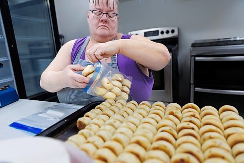 MIKE DEAL / FREE PRESS
After the buns have cooled off they get packaged up.
Deb Rogalsky, founder of Deb's Meat Buns, runs her home-based enterprise out of a commercial kitchen attached to her home in Landmark, Manitoba. 
She bakes as many as 300 dozen meat buns a week.
She turns out over a dozen varieties of meat buns, or perishky, including pulled pork, buffalo chicken and taco - as well as one called the Original (ground beef, onions, mashed potatoes) based on a recipe developed by Deb's mom, decades ago. 
Reporter: Dave Sanderson
241009 - Wednesday, October 09, 2024.