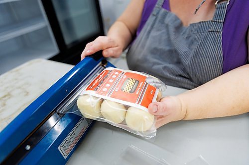 MIKE DEAL / FREE PRESS
The package of buns is sealed in to their bag.
Deb Rogalsky, founder of Deb's Meat Buns, runs her home-based enterprise out of a commercial kitchen attached to her home in Landmark, Manitoba. 
She bakes as many as 300 dozen meat buns a week.
She turns out over a dozen varieties of meat buns, or perishky, including pulled pork, buffalo chicken and taco - as well as one called the Original (ground beef, onions, mashed potatoes) based on a recipe developed by Deb's mom, decades ago. 
Reporter: Dave Sanderson
241009 - Wednesday, October 09, 2024.