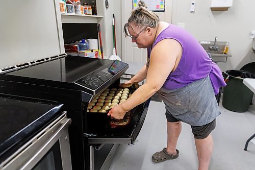 MIKE DEAL / FREE PRESS
Buns come out of the oven.
Deb Rogalsky, founder of Deb's Meat Buns, runs her home-based enterprise out of a commercial kitchen attached to her home in Landmark, Manitoba. 
She bakes as many as 300 dozen meat buns a week.
She turns out over a dozen varieties of meat buns, or perishky, including pulled pork, buffalo chicken and taco - as well as one called the Original (ground beef, onions, mashed potatoes) based on a recipe developed by Deb's mom, decades ago. 
Reporter: Dave Sanderson
241009 - Wednesday, October 09, 2024.