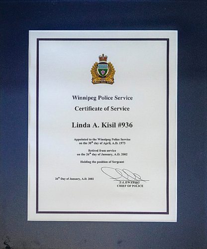 MIKAELA MACKENZIE / FREE PRESS
	
Linda Kisil&#x573; certificate of service for the Winnipeg Police Service.

For Josh passages story.
Winnipeg Free Press 2024