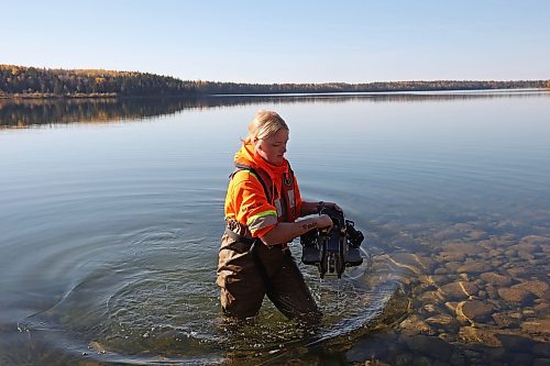 09102024
Caitlyn Stevenson, a Resource Management Technician with Parks Canada, carefully carries an underwater remote operated vehicle out of Clear Lake while inspecting a water-intake area used for the Clear Lake Golf Course with colleagues at Riding Mountain National Park on Wednesday. The technicians were conducting a general inspection as well as looking for evidence of zebra mussels and training some of technicians on operation of the ROV. The ROV is on loan to the park from the Parks Canada Archaeology branch. 
(Tim Smith/The Brandon Sun)