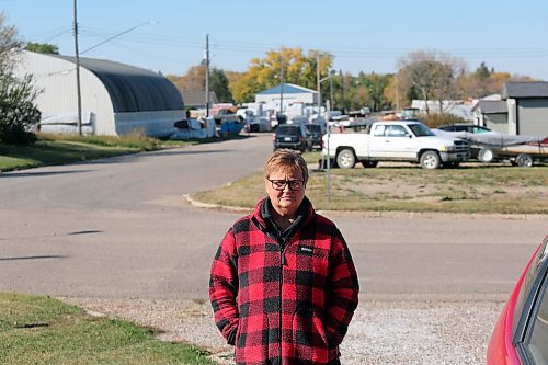 Rhonda Kleebaum stands in her driveway, in front of a street that has been closed for use by a manufacturing company. The company is set to expand its operations into the property across from her house, a move which a real estate agent told her would devalue her home by at least 10 per cent. (Connor McDowell/Brandon Sun)