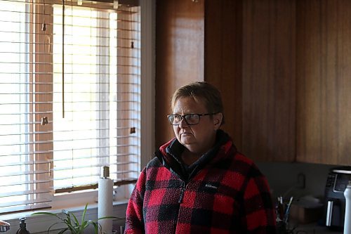 Rhonda Kleebaum stands in her kitchen. Outside her kitchen window is a property that the municpality announced it would sell to a private company for industrial expansion. She and her husband say they were not alerted of the plan. (Connor McDowell/Brandon Sun)