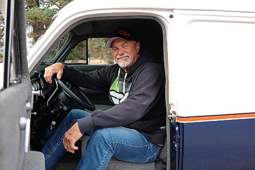 Tomiski sits behind the wheel of his 1948 Chevrolet Sedan Delivery. (Michele McDougall/The Brandon Sun) 

