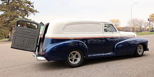 A side shot of Darrell Tomiski's 1948 Chevrolet Sedan Delivery with the back door open. The door and the indent in the chrome bumper make it easy to load and unload. Tomiski has owned the car since July, but years ago it was the delivery vehicle for a grocery store in Winnipeg. (Michele McDougall/The Brandon Sun)  
