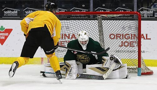 Brandon Wheat Kings goaltender Ethan Eskit makes a save on defenceman Luke Shipley during practice at Westoba Place on Wednesday afternoon. The team plays the Medicine Hat Tigers tonight and the Lethbridge Hurricanes on Saturday during a quick trip to Alberta. (Perry Bergson/The Brandon Sun)