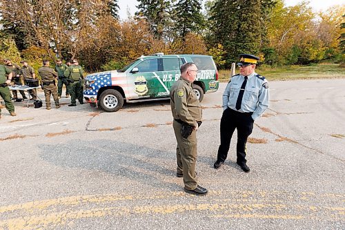 MIKE DEAL / FREE PRESS
Sergeant Lance Goldau (right), head of the Manitoba RCMP&#x2019;s Integrated Border Enforcement Team and U.S. Chief Border Patrol Agent Scott Garrett speak during a show-and-tell of some specialized equipment at the old border crossing in Emerson, MB, Thursday morning.
Manitoba RCMP officers and agents from United States Border Patrol met first in Pembina, North Dakota and then at Emerson, MB, Thursday morning, to talk about border safety and showcase some of the equipment used in preventing border incursions.
Reporter: Erik Pindera
241010 - Thursday, October 10, 2024.