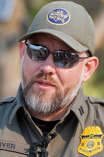 MIKE DEAL / FREE PRESS
Acting Supervisory Border Patrol Agent
Chris Oliver, during a show-and-tell of some specialized night-vision scopes and drones, which are reflected in his sunglasses, at the old border crossing in Emerson, MB, Thursday morning.
Manitoba RCMP officers and agents from United States Border Patrol met first in Pembina, North Dakota and then at Emerson, MB, Thursday morning, to talk about border safety and showcase some of the equipment used in preventing border incursions.
Reporter: Erik Pindera
241010 - Thursday, October 10, 2024.