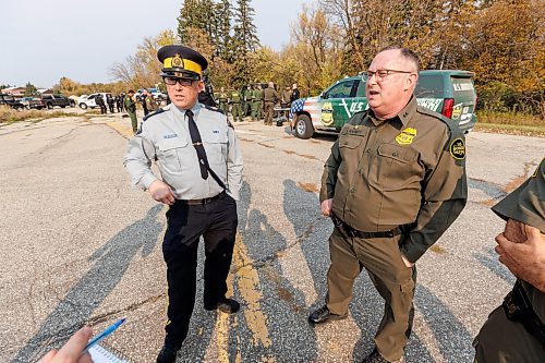 MIKE DEAL / FREE PRESS
Sergeant Lance Goldau (left), head of the Manitoba RCMP&#x2019;s Integrated Border Enforcement Team and U.S. Chief Border Patrol Agent Scott Garrett speak during a show-and-tell of some specialized equipment at the old border crossing in Emerson, MB, Thursday morning.
Manitoba RCMP officers and agents from United States Border Patrol met first in Pembina, North Dakota and then at Emerson, MB, Thursday morning, to talk about border safety and showcase some of the equipment used in preventing border incursions.
Reporter: Erik Pindera
241010 - Thursday, October 10, 2024.