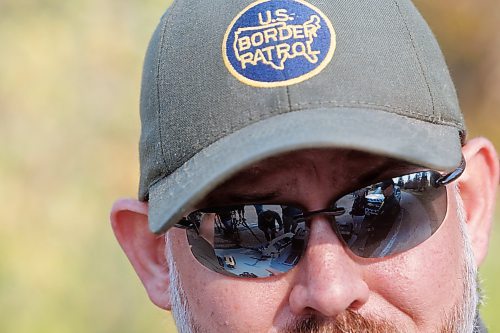 MIKE DEAL / FREE PRESS
Acting Supervisory Border Patrol Agent
Chris Oliver, during a show-and-tell of some specialized night-vision scopes and drones, which are reflected in his sunglasses, at the old border crossing in Emerson, MB, Thursday morning.
Manitoba RCMP officers and agents from United States Border Patrol met first in Pembina, North Dakota and then at Emerson, MB, Thursday morning, to talk about border safety and showcase some of the equipment used in preventing border incursions.
Reporter: Erik Pindera
241010 - Thursday, October 10, 2024.