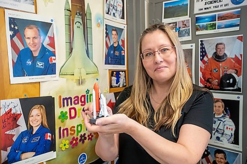 BROOK JONES / FREE PRESS
Grade 7 and 8 science, technology, engineering and math teacher Maria Nickel is pictured holding a modle of a Space Shuttle while in her classroom at &#xc9;cole Stonewall Centennial School in Stonewall, Man., Thursday, Oct. 10, 2024. The 54-year-old teaches STEM 8 Option students about the Canadian Space Agency's Rover Driving Academy with the company's mission control. Student teams were able to command via a remote computer accesss program a rover on a simulated lunar surface that the Canaidan Space Agency is developing in Longueil, Que., to go to the moon's surface.