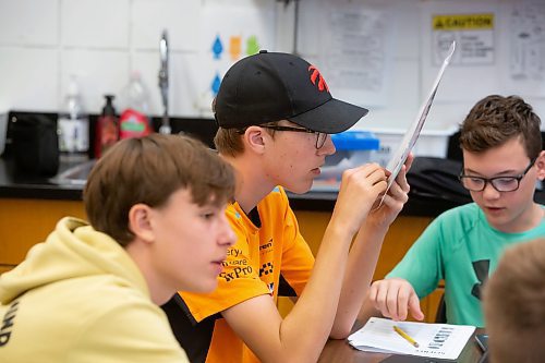 BROOK JONES / FREE PRESS
Grade 8 STEM Option students Ty Mitchell (middle), Xavier Lamb (left) and Nolan Grantham (right) are pictured looking over the mission goals and problem solving sheets at &#xc9;cole Stonewall Centennial School in Stonewall, Man., Thursday, Oct. 10, 2024. STEM 8 Option students particpate in the Canadian Space Agency's Rover Driving Academy with the company's mission control. Student teams were able to command via a remote computer accesss program a rover on a simulated lunar surface that the Canaidan Space Agency is developing in Longueil, Que., to go to the moon's surface.