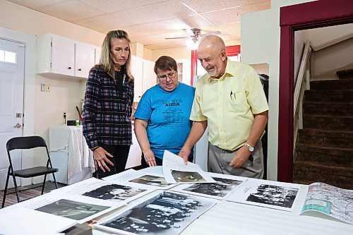 10102024
Frank Cedar of Ottawa goes over photos of Brandon&#x2019;s polish community with Lori-Lynn Sanduliak, whose relatives are featured, and Eileen Trott, curator of the Daly House Museum, on Thursday. Cedar has an exhibition of the history of the Brandon Polish Community in photos opening at the Daly House in mid November. The exhibit will feature photos from Poland, Brandon and Melville.
(Tim Smith/The Brandon Sun)
