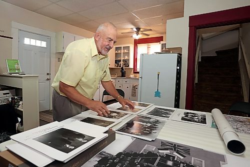 10102024
Frank Cedar of Ottawa looks over historical photos of Brandon&#x2019;s Polish community at the Daly House Museum on Thursday. Cedar has an exhibition of the history of the Brandon Polish Community in photos opening at the Daly House in mid November. The exhibit will feature photos from Poland, Brandon and Melville. 
(Tim Smith/The Brandon Sun)
