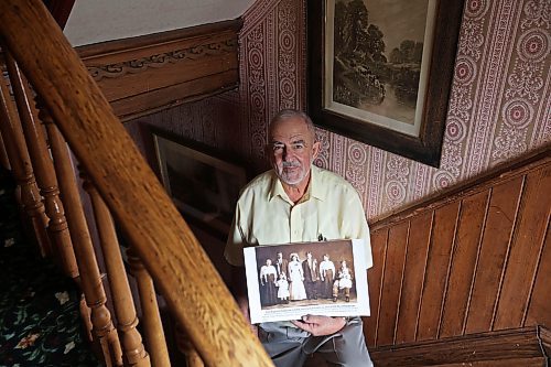 10102024
Frank Cedar of Ottawa holds a historical photo of his Polish family in Melville, Saskatchewan in 1913, at the Daly House Museum on Thursday. Cedar has an exhibition of the history of the Brandon Polish Community in photos opening at the Daly House in mid November. The exhibit will feature photos from Poland, Brandon and Melville. 
(Tim Smith/The Brandon Sun)
