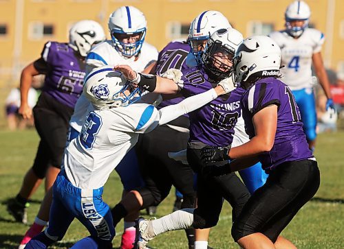 Quarterback Coleton Malyon of the Vincent Massey Vikings tries to break free from Elliot Falk of the River East Kodiaks while running the ball during WHSFL action at Doug Steeves Field on a beautiful Friday afternoon. (Tim Smith/The Brandon Sun)

(Tim Smith/The Brandon Sun)