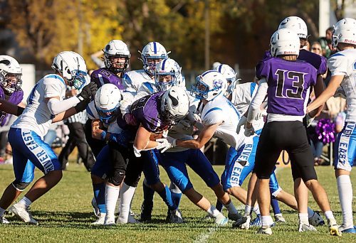 11102024
Brayden Smith #28 of the Vincent Massey Vikings tries to get through a gauntlet of River East Kodiaks players during high school varsity football action at VMHS on a beautiful Friday afternoon. 
(Tim Smith/The Brandon Sun)