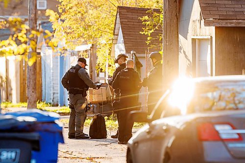 MIKE DEAL / FREE PRESS
Winnipeg Police Service tactical unit along with the armoured truck, drone operators and K9 units surround a house at 781 Flora Avenue to serve a search warrant early Friday morning. An ambulance and two Animal Services vans were on the scene as well.
241011 - Friday, October 11, 2024.