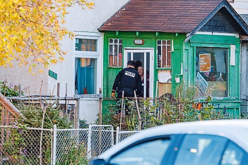 MIKE DEAL / FREE PRESS
Winnipeg Police Service tactical unit along with the armoured truck, drone operators and K9 units surround a house at 781 Flora Avenue to serve a search warrant early Friday morning. An ambulance and two Animal Services vans were on the scene as well.
241011 - Friday, October 11, 2024.