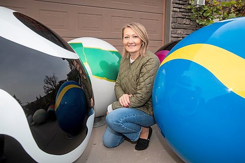 BROOK JONES/FREE PRESS
Erica Swendrowski is pictured with giant fibreglass marbles in her driveway in Winnipeg, Man., Thursday, Oct. 10, 2024. The local artist and landscape dsesigner is refurbishing the marbles she created as a public art piece dubbed Marbles at Mayfair which is a City of Winnipeg Public Art Collection.