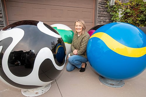 BROOK JONES/FREE PRESS
Erica Swendrowski is pictured with giant fibreglass marbles in her driveway in Winnipeg, Man., Thursday, Oct. 10, 2024. The local artist and landscape dsesigner is refurbishing the marbles she created as a public art piece dubbed Marbles at Mayfair which is a City of Winnipeg Public Art Collection.