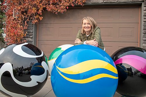 BROOK JONES/FREE PRESS
Erica Swendrowski is pictured with giant fibreglass marbles in her driveway in Winnipeg, Man., Thursday, Oct. 10, 2024. The local artist and landscape dsesigner is refurbishing the marbles she created as a public art piece dubbed Marbles at Mayfair which is a City of Winnipeg Public Art Collection.